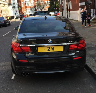 UK Number Plate 2 W on a 2026 Green Porsche