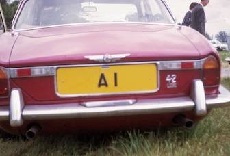 UK Number Plate A 1 on a Red Jaguar XJ6