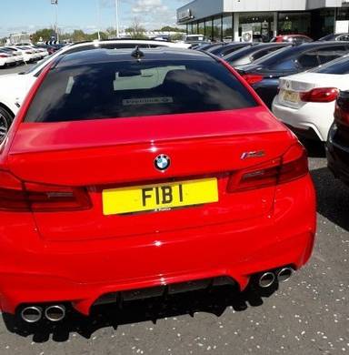 UK Number Plate FIB 1 on a Red BMW M5