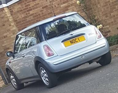UK Number Plate NOC 1 on a Silver Mini Cooper