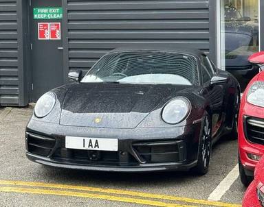 UK Number Plate 1 AA on a 2021 Black Porsche 911 Targa 4s
