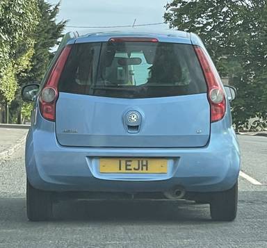 UK Number Plate 1 EJH on a 2010 Blue Vauxhall Agila
