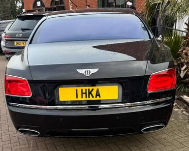 UK Number Plate 1 HKA on a 2015 Black Bentley Flying Spur