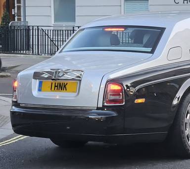 UK Number Plate 1 HNK on a 2015 Black Rolls Royce Phantom