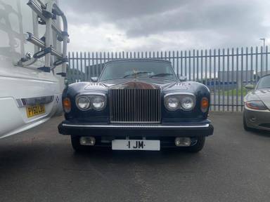 UK Number Plate 1 JM on a 2002 Silver Rolls Royce Corniche