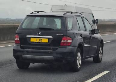 UK Number Plate 1 JX on a 2007 Black Mercedes ML