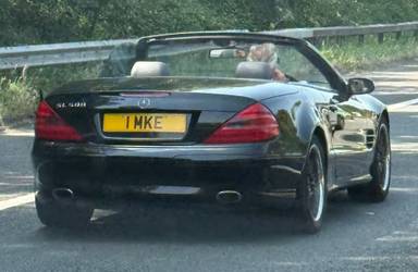 UK Number Plate 1 MKE on a 2003 Black Mercedes SL