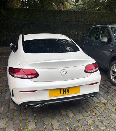 UK Number Plate 1 NV on a 2019 White Mercedes-Benz C