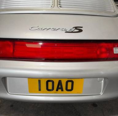 UK Number Plate 1 OAO on a 1997 Silver Porsche 911