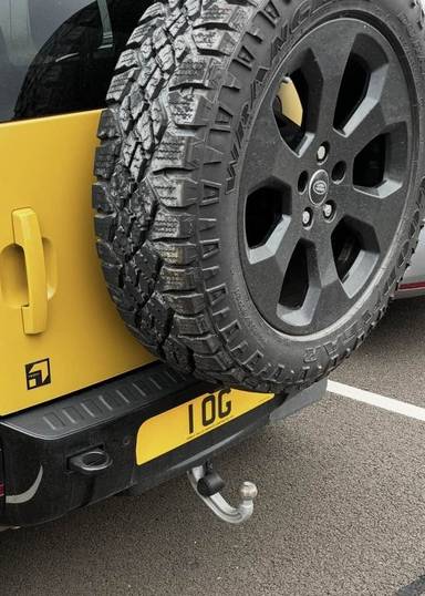UK Number Plate 1 OG on a 2026 Yellow Land Rover Defender Tr Ed Sndgl D Mhev A