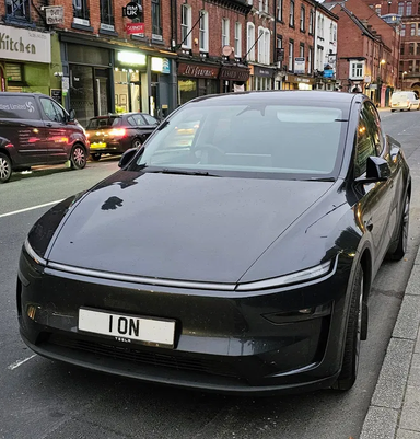 UK Number Plate 1 ON on a 2025 Grey Tesla Continental