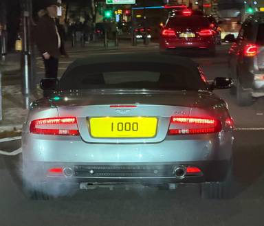 UK Number Plate 1 OOO on a 2007 Silver Aston Martin DB9