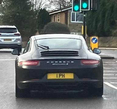 UK Number Plate 1 PH on a 2012 Black Porsche 911