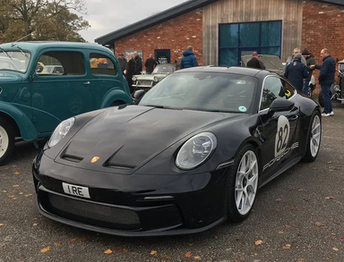 UK Number Plate 1 RE on a 2025 Black Porsche 911 S/T