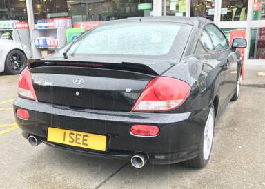 UK Number Plate 1 SEE on a 2005 Black Hyundai Coupe