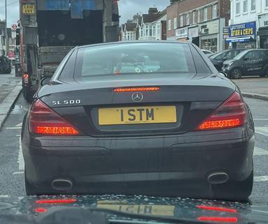 UK Number Plate 1 STM on a 2017 Black Mercedes-Benz SL