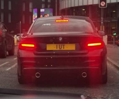 UK Number Plate 1 UT on a Black BMW 218