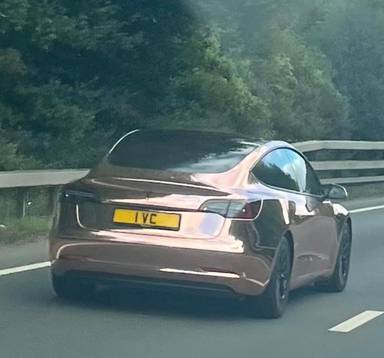 UK Number Plate 1 VC on a 2021 Gold Tesla Model 3 Long Range Awd