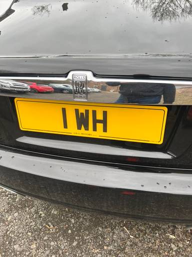 UK Number Plate 1 WH on a 2018 Black Rolls Royce Ghost