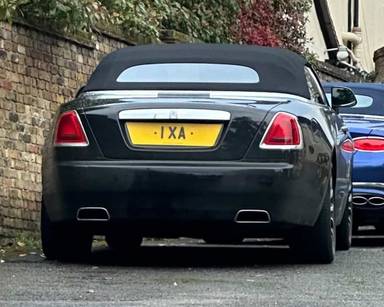 UK Number Plate 1 XA on a 2018 Black Rolls Royce Dawn
