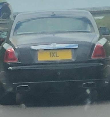 UK Number Plate 1 XL on a 2012 Black Rolls Royce Ghost