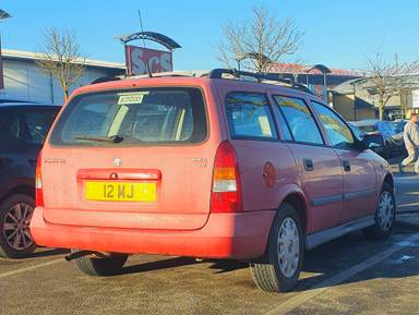 UK Number Plate 12 MJ on a 1999 RED Vauxhall Astra