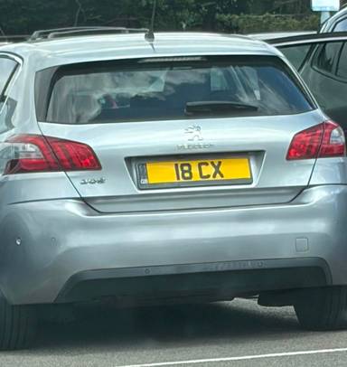UK Number Plate 18 CX on a 2019 Grey Peugeot 308