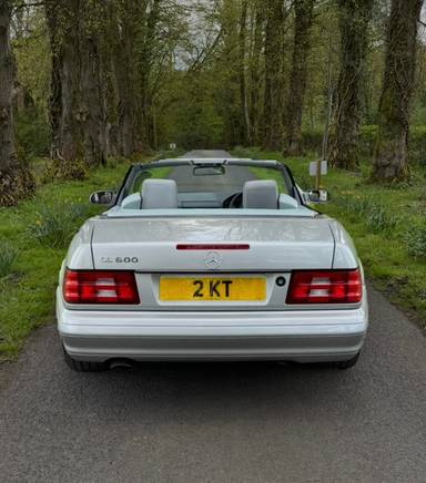 UK Number Plate 2 KT on a 2000 Silver Mercedes SL