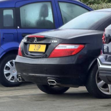 UK Number Plate 2 UP on a 2012 Black Mercedes-Benz SLK
