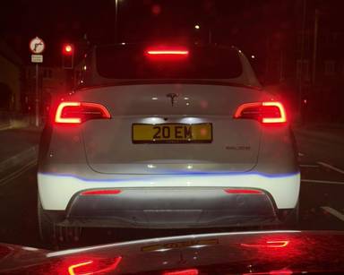 UK Number Plate 20 EM on a 2022 White Tesla Model Y Performance Awd