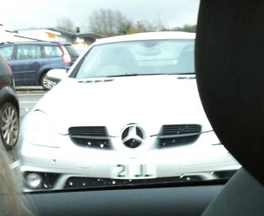 UK Number Plate 21 JL on a 2005 Silver Mercedes SLK