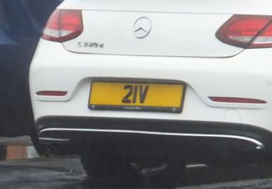 UK Number Plate 21 V on a 2016 White Mercedes-Benz C