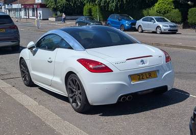 UK Number Plate 22 LR on a 2010 White Peugeot RCZ