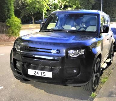 UK Number Plate 24 TS on a 2025 Black Land Rover Defender Xdynamic Hse D Mhev A
