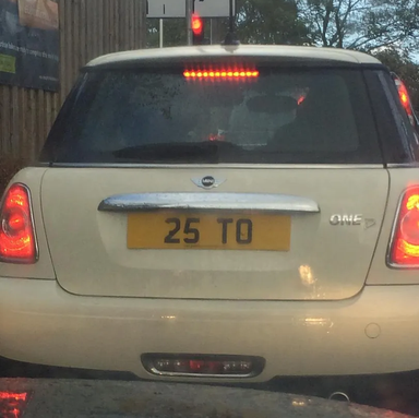 UK Number Plate 25 TO on a 2010 White Mini Mini