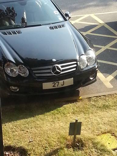 UK Number Plate 27 J on a 2006 Black Mercedes SL