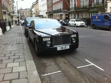 UK Number Plate 28 JC on a 2004 Black Rolls Royce Phantom