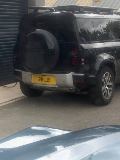UK Number Plate 28 LB on a 2024 Black Land Rover Defender Xs Edition Phev Auto