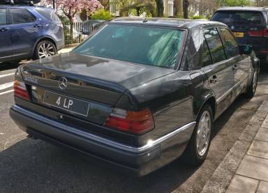 UK Number Plate 4 LP on a 1993 Black Mercedes E