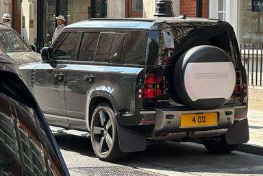 UK Number Plate 4 OD on a 2021 Black Land Rover Defender Xdynamic Hse D Mhev A
