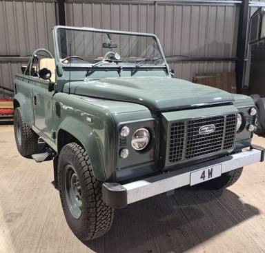 UK Number Plate 4 W on a 2012 Green Land Rover Defender