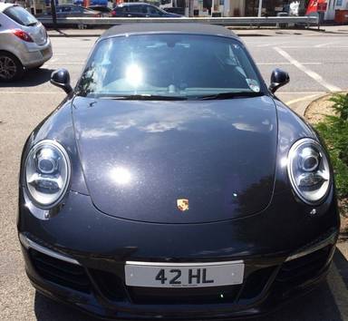 UK Number Plate 42 HL on a 2012 Black Porsche 911