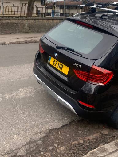 UK Number Plate 42 NR on a 2013 Black BMW X1
