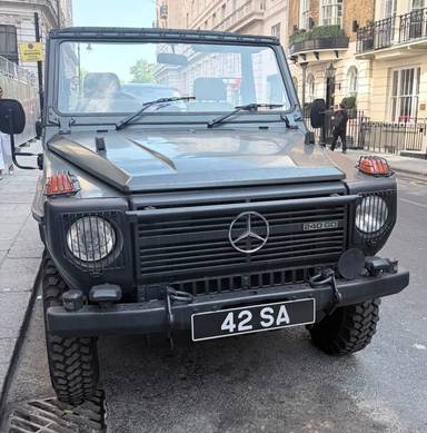 UK Number Plate 42 SA on a 1990 Green Mercedes-Benz G Wagon