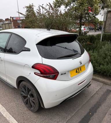 UK Number Plate 43 V on a 2018 White Peugeot 208