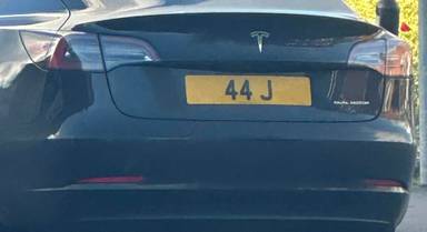 UK Number Plate 44 J on a 2021 Black Tesla Model 3 Long Range Awd