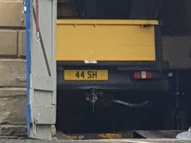 UK Number Plate 44 SH on a 1987 Yellow Ford Transit