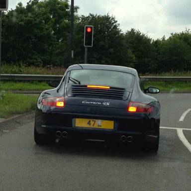 UK Number Plate 47 E on a 2006 Blue Porsche 911