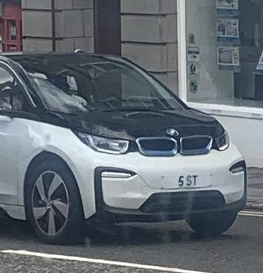 UK Number Plate 5 ST on a 2020 White BMW I3