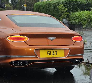 UK Number Plate 51 AT on a 2022 Orange Bentley Continental Gt V8 Auto